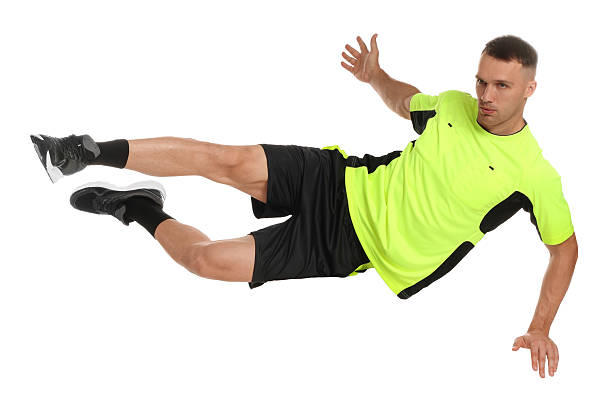 istock Football player in sportswear training on white background 2229553653