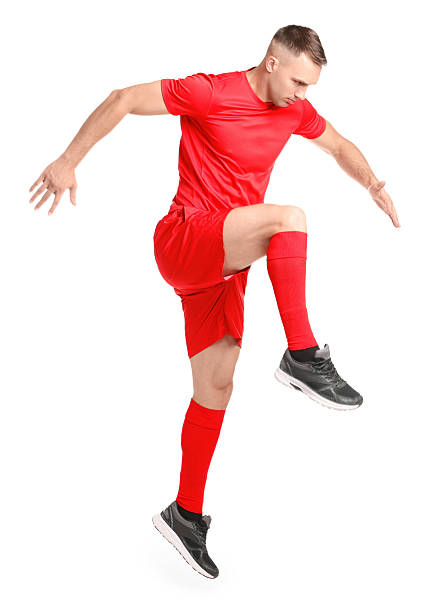 istock Football player in sportswear training on white background 2229553682