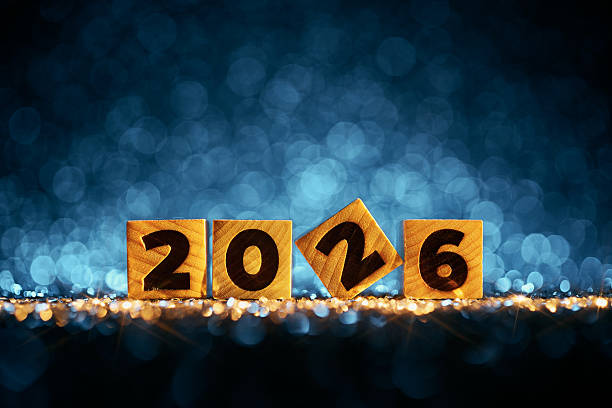 istock Creative 2026 Typography on Wooden Blocks with Sparkling Blue Bokeh Background 2229553742