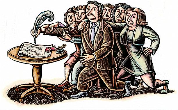 citizens hold the arm of a politician as he signs a document or law