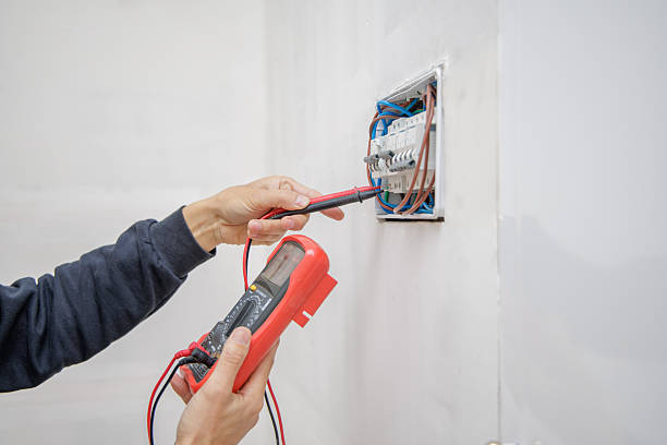 istock Hands of an electrician measuring electrical voltage with a voltmeter. 2229554682