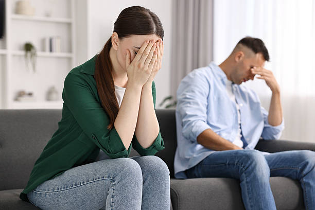 istock Upset woman ignoring her husband at home, selective focus 2229555069