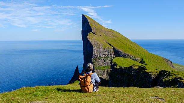 istock Exploring the breathtaking cliffs of the Faroe Islands on a sunny day 2229556197