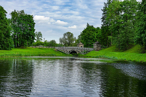 Trakai, Lithuania, 17th of July 2024 - Wooden bridge leads to the historic Trakai Island Castle in Lithuania, surrounded by blue skies and calm lake waters
