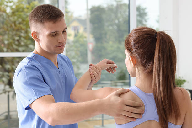 istock Osteopath working with patient in clinic. Manual therapy 2229559898