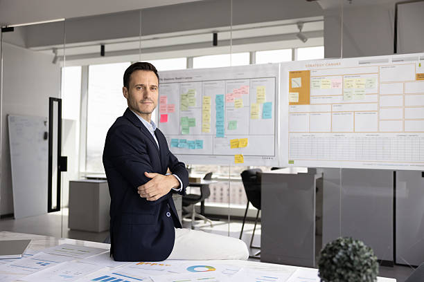 istock Confident Latin businessman posing for professional portrait at office workplace 2229560015