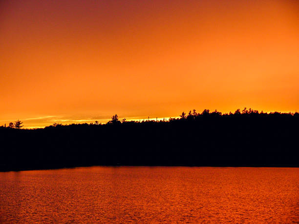 istock Flame-Orange Sky Sunset Over Still Forest Lake 2229561416