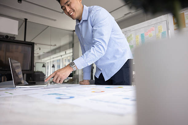 istock Positive Asian business project analyst man doing marketing research 2229563788