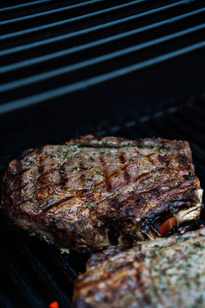 istock Well grilled huge steak on BBQ gas grill 2229563906
