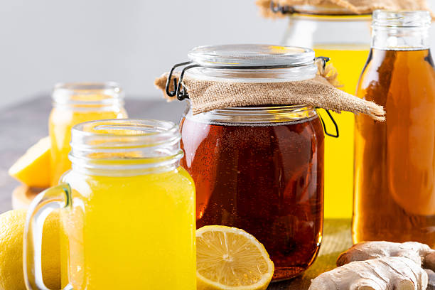 istock Colorful Kombucha Jars and Bottles on wooden table 2229563992