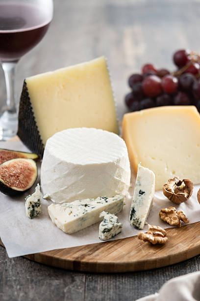 istock Board of different cheeses with nuts, figs and grapes 2229564150