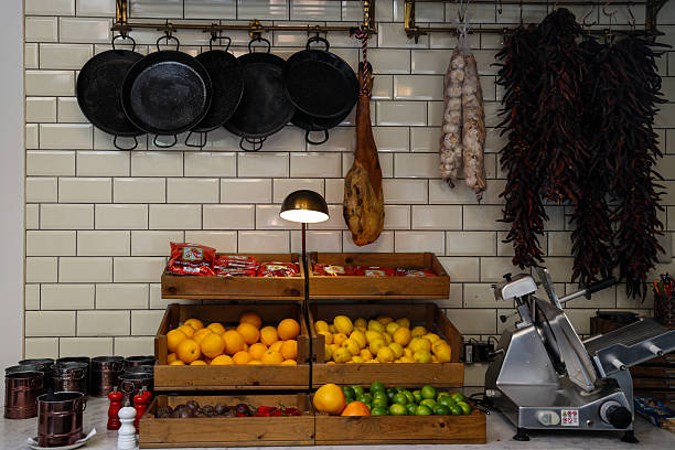 istock Spanish Deli Counter with Fresh Produce and Hanging Cured Ham 2229565124