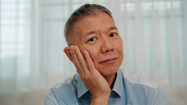 istock Confident elderly Asian man facing the camera with a contented smile and confidence 2229565261