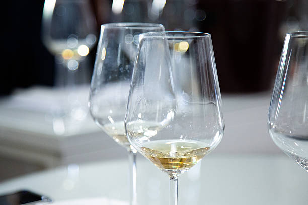istock On the table sit three wine glasses filled with white wine 2229566326