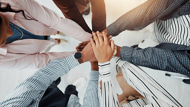 istock Stack of hands, support and business people in office with teamwork, collaboration or unity. Trust, top view and group of corporate employees in huddle for solidarity, motivation or meeting together. 2229571131