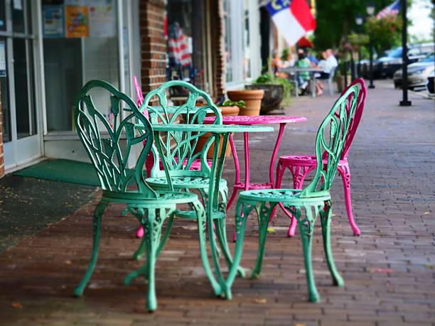 istock Colorful chairs on a quaint town sidewalk. 2229571827