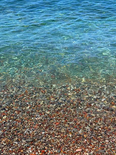 istock Sea and colorful pebbles on the beach. 2229572492