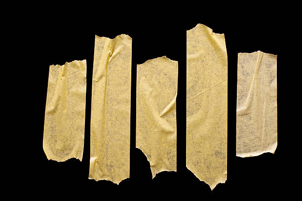 istock Masking tape isolated on black background. 2229572812
