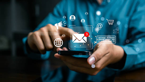 istock Businessman using smartphone for email communication with digital marketing icons, sending messages online, social media connection, business technology, and professional networking concept. 2229573295