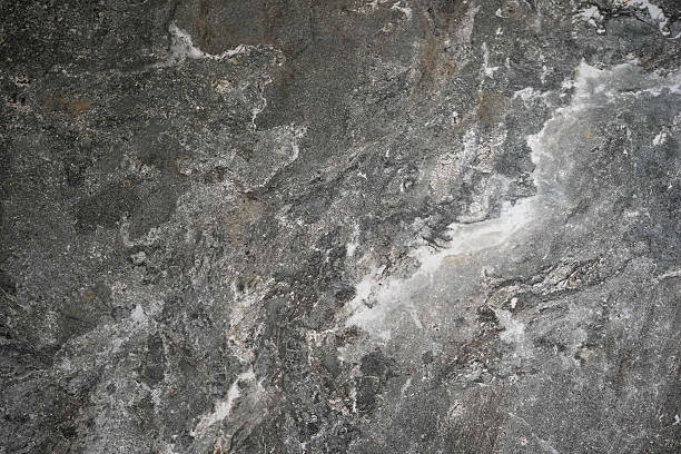 istock a textured dark gray stone surface with natural white and light gray streaks and patterns 2229573602
