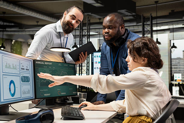istock Multiethnic group of people engaged in strategy planning and report writing 2229574915