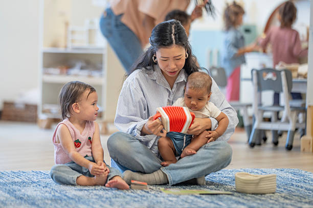 istock Mother with Two Children Reading in Cozy Playful Classroom Environment 2229577068