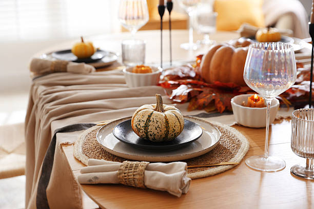 istock Stylish table setting with beautiful dishware and autumn decor in dining room 2229577665