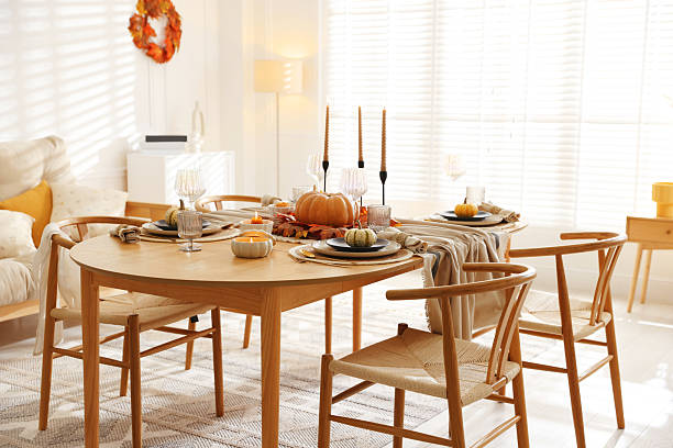 istock Stylish table setting with beautiful dishware and autumn decor in dining room 2229577691