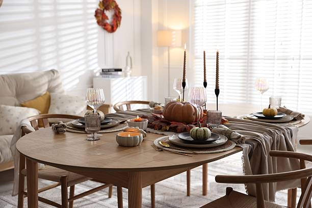 istock Stylish table setting with beautiful dishware and autumn decor in dining room 2229577702