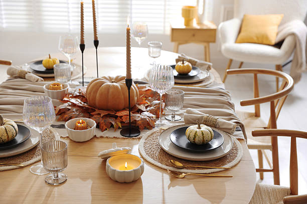 istock Stylish table setting with beautiful dishware and autumn decor in dining room 2229577766