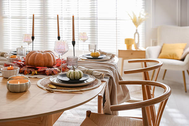istock Stylish table setting with beautiful dishware and autumn decor in dining room 2229577791