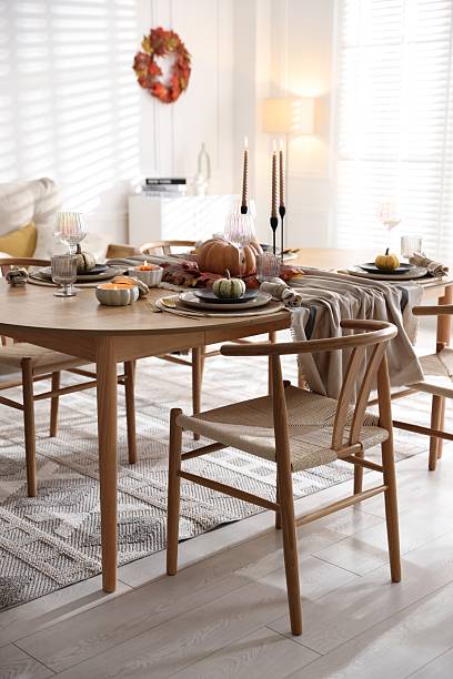 istock Stylish table setting with beautiful dishware and autumn decor in dining room 2229577953
