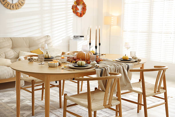 istock Stylish table setting with beautiful dishware and autumn decor in dining room 2229577969