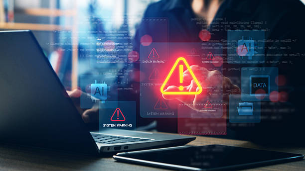 istock Cybersecurity system warning alert on laptop with AI and data icons, concept of artificial intelligence risks, data breach, malware attack, digital security, and technology protection. 2229578327