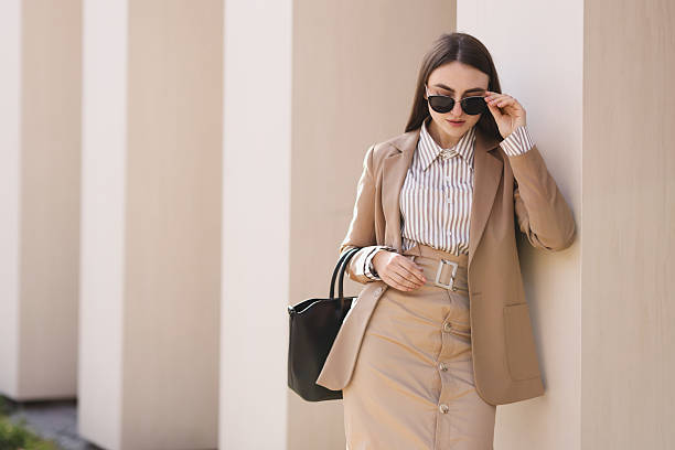 istock Beautiful woman in stylish suit outdoors. Space for text 2229578571