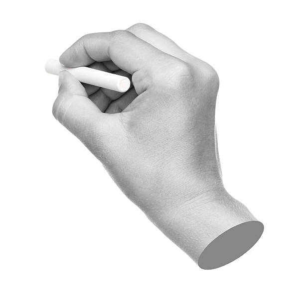 istock Hand holds white chalk for chalkboard, isolated on transparent background, education concept. Contemporary art 2229579038