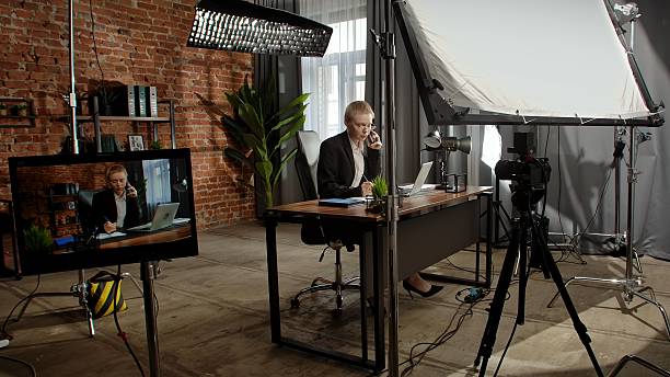 istock Businesswoman in Office Talking on Phone and Using Laptop 2229579473