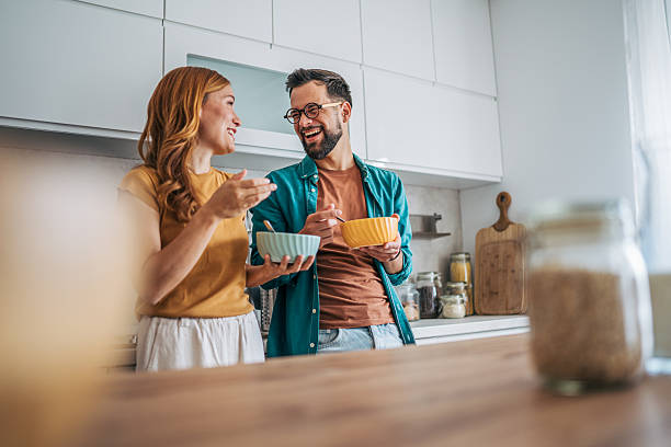istock Cheerful couple enjoying breakfast and sharing a laugh in modern kitchen 2229580072