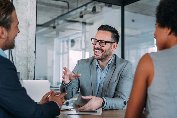 istock Group of business persons talking in the office. 2229582520
