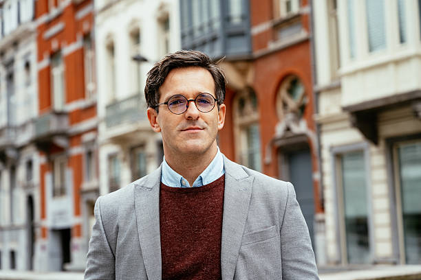 istock Handsome mature financial executive looking at camera in financial district 2229586144