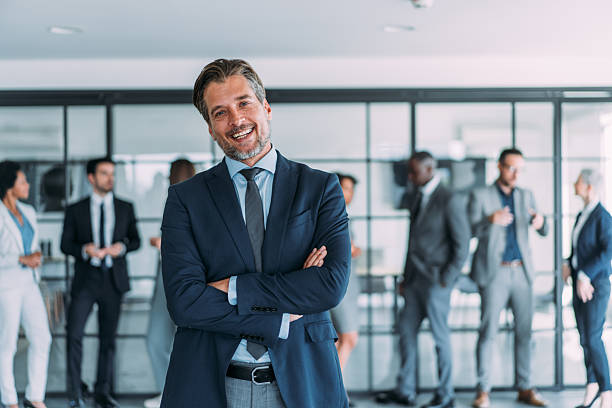 istock Confident businessman and his team. 2229590923