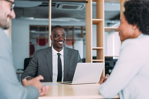 istock Group of business persons talking in the office. 2229590998