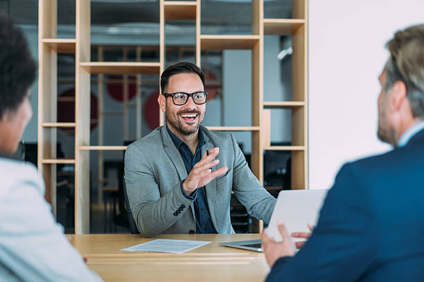 istock Group of business persons talking in the office. 2229591061