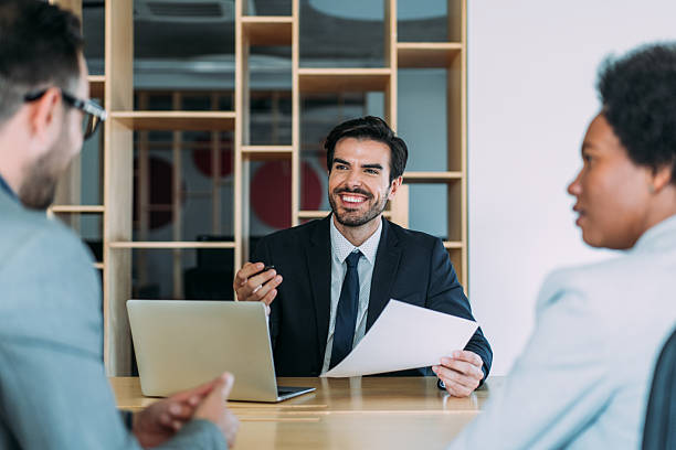 istock Group of business persons talking in the office. 2229591296