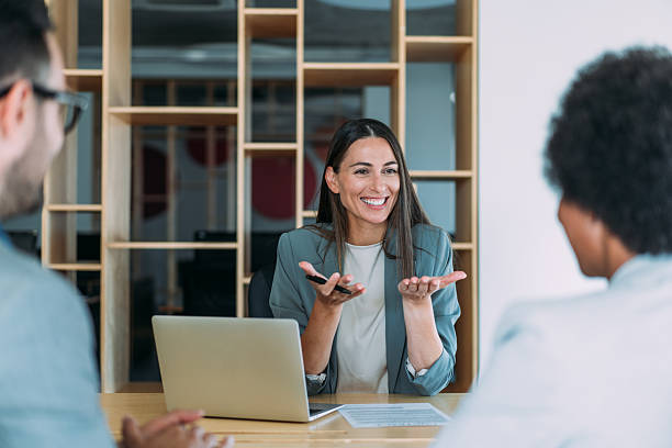 istock Group of business persons talking in the office. 2229591312