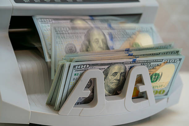 istock Currency Counting Machine in Action at a Financial Institution 2229591922