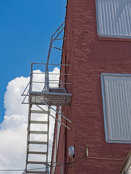 Staircase along side of brick food processing plant. Safety first in factory setting.