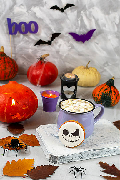 istock Decorative Halloween setup with hot cocoa and spooky themed elements 2229594645