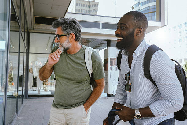 istock Two Men Looking at Storefronts and Considering Shopping – Casual City Stroll and Window Shopping 2229594885