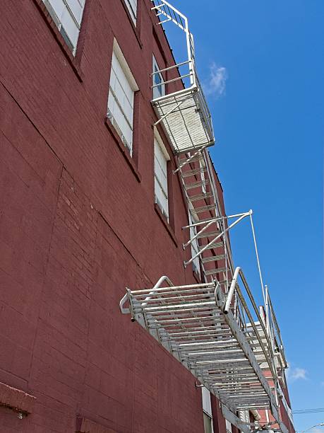 Staircase along side of brick food processing plant. Safety first in factory setting.